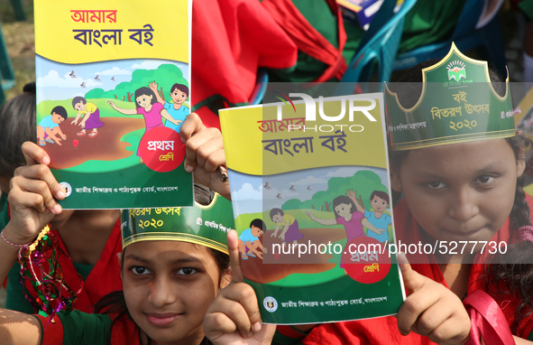 Bangladeshi Students receive free textbooks from government to celebrate on the first day of the New Year in Dhaka on January 1, 2020. The B...