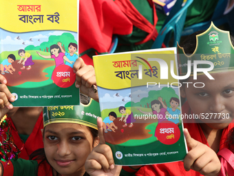 Bangladeshi Students receive free textbooks from government to celebrate on the first day of the New Year in Dhaka on January 1, 2020. The B...