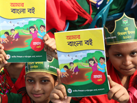 Bangladeshi Students receive free textbooks from government to celebrate on the first day of the New Year in Dhaka on January 1, 2020. The B...