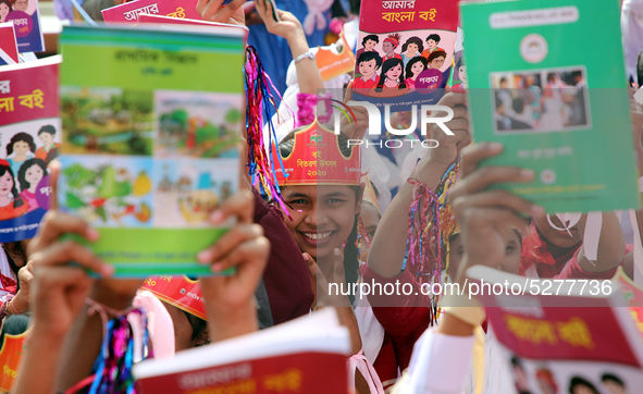 Bangladeshi Students receive free textbooks from government to celebrate on the first day of the New Year in Dhaka on January 1, 2020. The B...