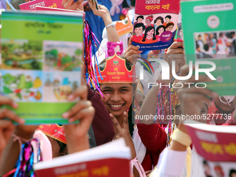 Bangladeshi Students receive free textbooks from government to celebrate on the first day of the New Year in Dhaka on January 1, 2020. The B...