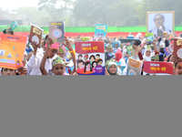 Student celebrate with new textbooks in hand at the Dhaka University sports ground the Dhaka University sports ground as the government kick...