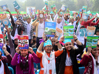 Student celebrate with new textbooks in hand at the Dhaka University sports ground the Dhaka University sports ground as the government kick...