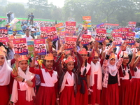 Student celebrate with new textbooks in hand at the Dhaka University sports ground the Dhaka University sports ground as the government kick...