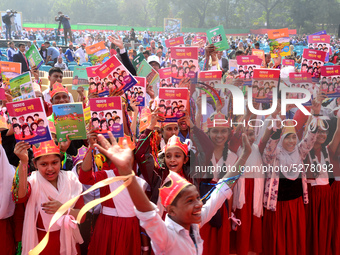 Student celebrate with new textbooks in hand at the Dhaka University sports ground the Dhaka University sports ground as the government kick...