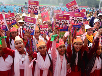 Student celebrate with new textbooks in hand at the Dhaka University sports ground the Dhaka University sports ground as the government kick...