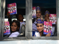 Student celebrate with new textbooks in hand at the Dhaka University sports ground the Dhaka University sports ground as the government kick...