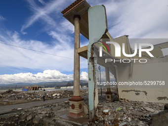 A resident in front of a house damaged by the tsunami in Kampung Lere Beach, Palu Bay, Central Sulawesi, Indonesia on January 9, 2020.  The...