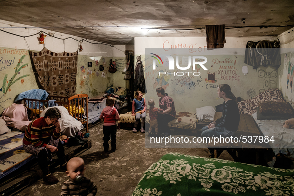 Typical room for a family in the bunker. Here 7 people sleep and live in this room. The grandmother on the left, the mother and her five kid...