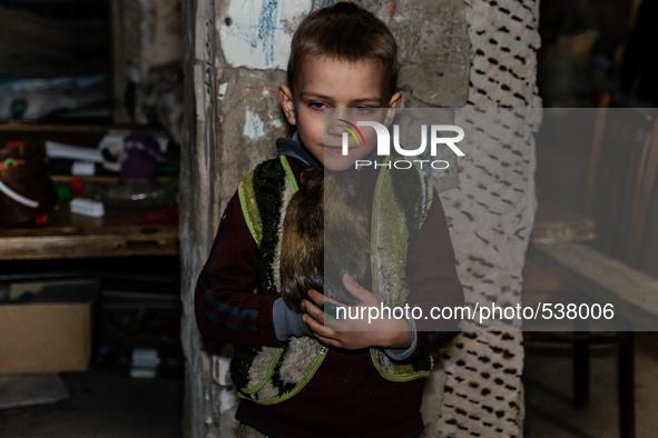 Pasha 6 years old with his guinea pig, Misha.  Last 12 and 15 of April 2015, with the help of Tomas Vlach, emergency coordinator for the NGO...