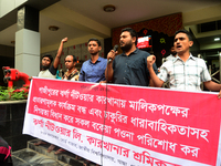 Garments workers of Jharna Knitwear Limited stage a demonstration in front of Department of Labor building demanding their due payment and e...