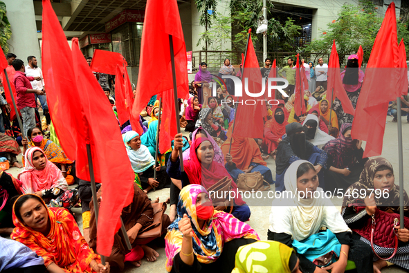 Garments workers of Jharna Knitwear Limited stage a demonstration in front of Department of Labor building demanding their due payment and e...