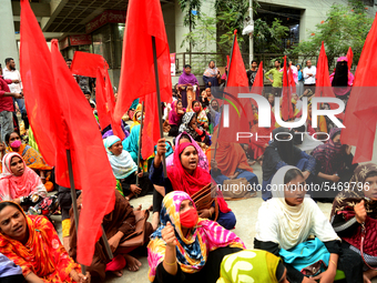 Garments workers of Jharna Knitwear Limited stage a demonstration in front of Department of Labor building demanding their due payment and e...