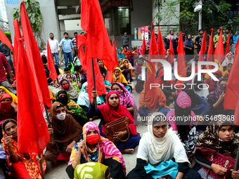 Garments workers of Jharna Knitwear Limited stage a demonstration in front of Department of Labor building demanding their due payment and e...