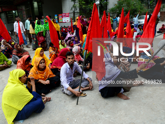 Garments workers of Jharna Knitwear Limited stage a demonstration in front of Department of Labor building demanding their due payment and e...