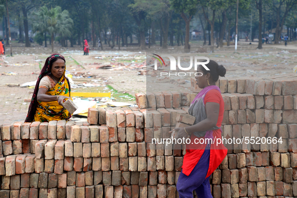 Bangladeshi woman daily labor works in a contraction site in Dhaka, Bangladesh, on March 7, 2020. Each woman labor earn 4.71 US dollar or 40...