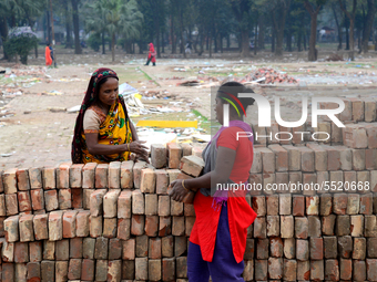 Bangladeshi woman daily labor works in a contraction site in Dhaka, Bangladesh, on March 7, 2020. Each woman labor earn 4.71 US dollar or 40...