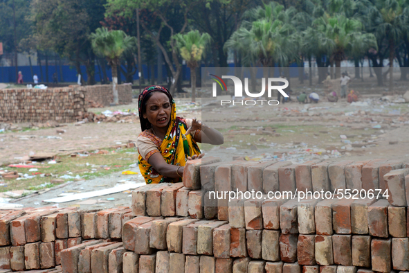 Bangladeshi woman daily labor works in a contraction site in Dhaka, Bangladesh, on March 7, 2020. Each woman labor earn 4.71 US dollar or 40...