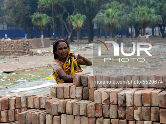 Bangladeshi woman daily labor works in a contraction site in Dhaka, Bangladesh, on March 7, 2020. Each woman labor earn 4.71 US dollar or 40...