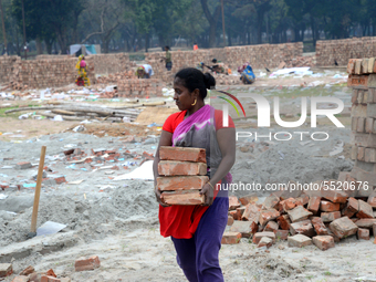 Bangladeshi woman daily labor works in a contraction site in Dhaka, Bangladesh, on March 7, 2020. Each woman labor earn 4.71 US dollar or 40...