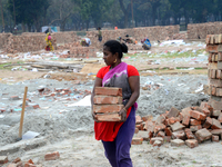 Bangladeshi woman daily labor works in a contraction site in Dhaka, Bangladesh, on March 7, 2020. Each woman labor earn 4.71 US dollar or 40...