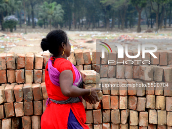 Bangladeshi woman daily labor works in a contraction site in Dhaka, Bangladesh, on March 7, 2020. Each woman labor earn 4.71 US dollar or 40...