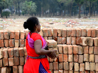 Bangladeshi woman daily labor works in a contraction site in Dhaka, Bangladesh, on March 7, 2020. Each woman labor earn 4.71 US dollar or 40...