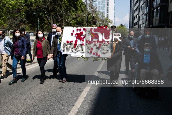 Syndicate members holding a wreath in order to lay it on the Taksim square Freedom monument for the May Day celebrations on 1 May, 2020, in...