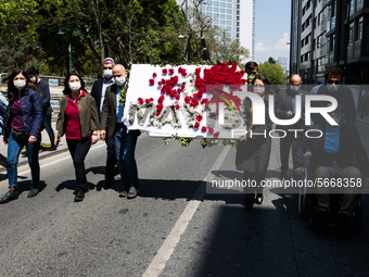 Syndicate members holding a wreath in order to lay it on the Taksim square Freedom monument for the May Day celebrations on 1 May, 2020, in...