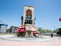 Syndicate members holding a wreath in order to lay it on the Taksim square Freedom monument for the May Day celebrations  on 1 May, 2020, in...