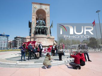 Syndicate members holding a wreath in order to lay it on the Taksim square Freedom monument for the May Day celebrations  on 1 May, 2020, in...