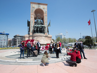 Syndicate members holding a wreath in order to lay it on the Taksim square Freedom monument for the May Day celebrations  on 1 May, 2020, in...