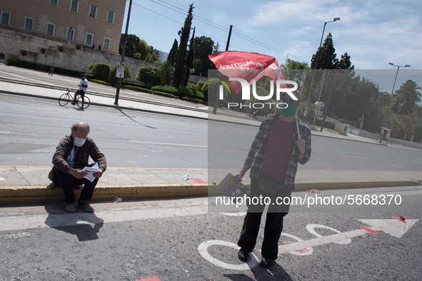 People wearing mask protest on International Worker's Day during the curfew due to Coronavirus (Covid-19) pandemic in Athens, Greece on May...