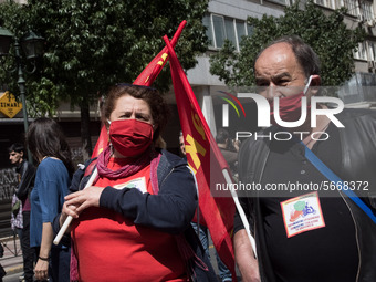 People wearing mask protest on International Worker's Day during the curfew due to Coronavirus (Covid-19) pandemic in Athens, Greece on May...