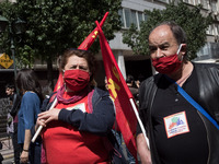 People wearing mask protest on International Worker's Day during the curfew due to Coronavirus (Covid-19) pandemic in Athens, Greece on May...