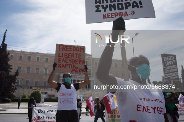 People wearing mask protest on International Worker's Day during the curfew due to Coronavirus (Covid-19) pandemic in Athens, Greece on May...