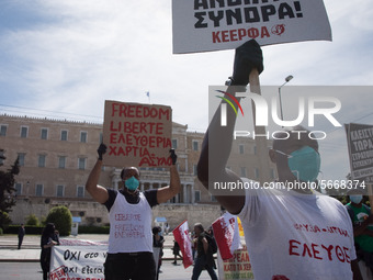 People wearing mask protest on International Worker's Day during the curfew due to Coronavirus (Covid-19) pandemic in Athens, Greece on May...