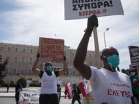 People wearing mask protest on International Worker's Day during the curfew due to Coronavirus (Covid-19) pandemic in Athens, Greece on May...