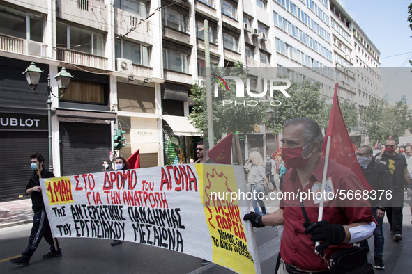 People wearing mask protest on International Worker's Day during the curfew due to Coronavirus (Covid-19) pandemic in Athens, Greece on May...