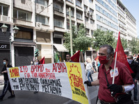 People wearing mask protest on International Worker's Day during the curfew due to Coronavirus (Covid-19) pandemic in Athens, Greece on May...