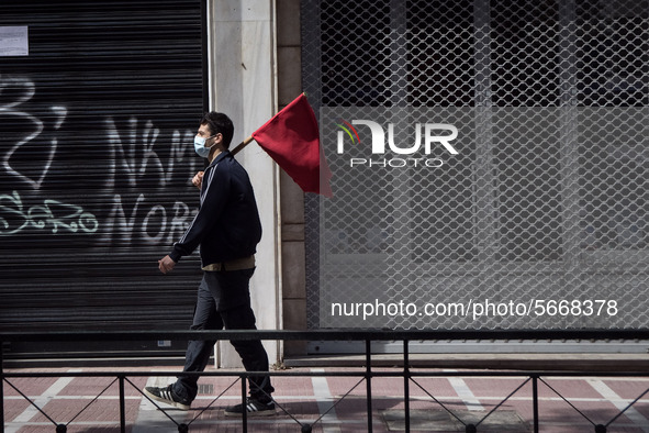 People wearing mask protest on International Worker's Day during the curfew due to Coronavirus (Covid-19) pandemic in Athens, Greece on May...