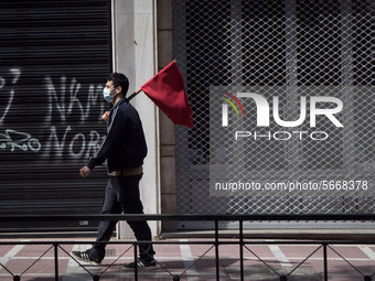 People wearing mask protest on International Worker's Day during the curfew due to Coronavirus (Covid-19) pandemic in Athens, Greece on May...