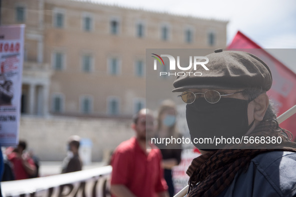 People wearing mask protest on International Worker's Day during the curfew due to Coronavirus (Covid-19) pandemic in Athens, Greece on May...