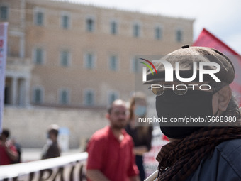 People wearing mask protest on International Worker's Day during the curfew due to Coronavirus (Covid-19) pandemic in Athens, Greece on May...