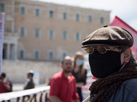 People wearing mask protest on International Worker's Day during the curfew due to Coronavirus (Covid-19) pandemic in Athens, Greece on May...