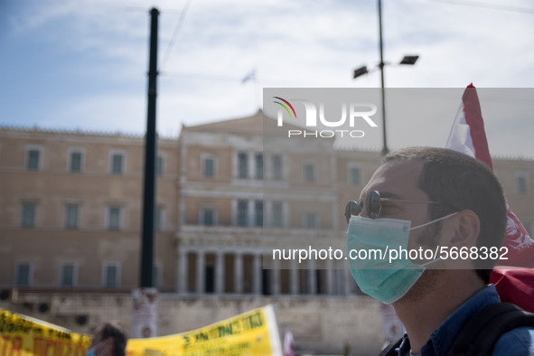 People wearing mask protest on International Worker's Day during the curfew due to Coronavirus (Covid-19) pandemic in Athens, Greece on May...