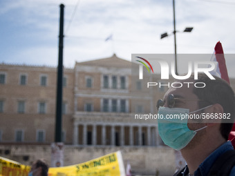 People wearing mask protest on International Worker's Day during the curfew due to Coronavirus (Covid-19) pandemic in Athens, Greece on May...