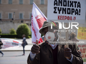 People wearing mask protest on International Worker's Day during the curfew due to Coronavirus (Covid-19) pandemic in Athens, Greece on May...