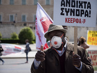 People wearing mask protest on International Worker's Day during the curfew due to Coronavirus (Covid-19) pandemic in Athens, Greece on May...