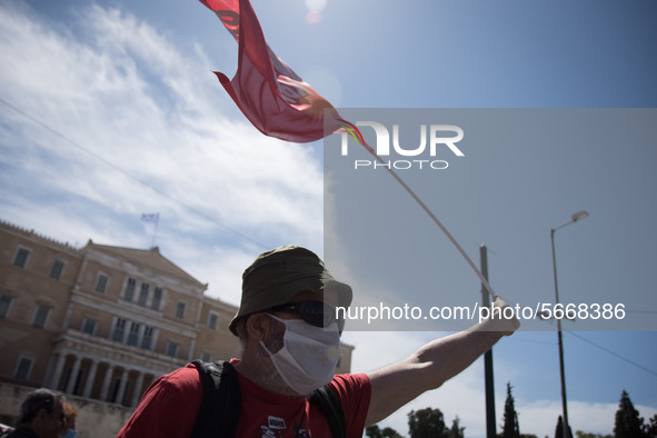 People wearing mask protest on International Worker's Day during the curfew due to Coronavirus (Covid-19) pandemic in Athens, Greece on May...